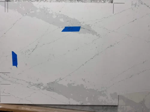 This quartz slab has a light-colored base with soft, natural veining, creating an elegant and versatile design. It is perfect for small vanity tops, shower seats, window sills, door sills, or similar applications.